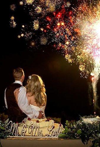 creative wedding photos couple sitting under fireworks-parrisphotography
