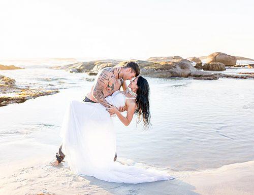 eloping married couple ocean