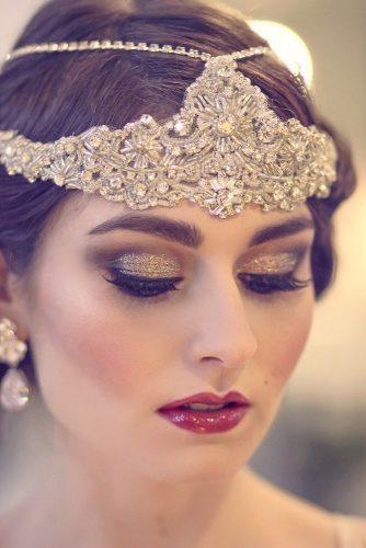 vintage wedding makeup with goldeb glitter eyeshadows and long lashes with red lips gbespoke via facebook