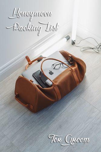 honeymoon packing list casual luggage with smartphone and notebook
