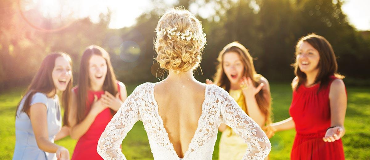 The Different Types of Bridesmaids bridesmaids looking at the bride