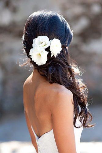 wedding hairstyles with white flower accessories