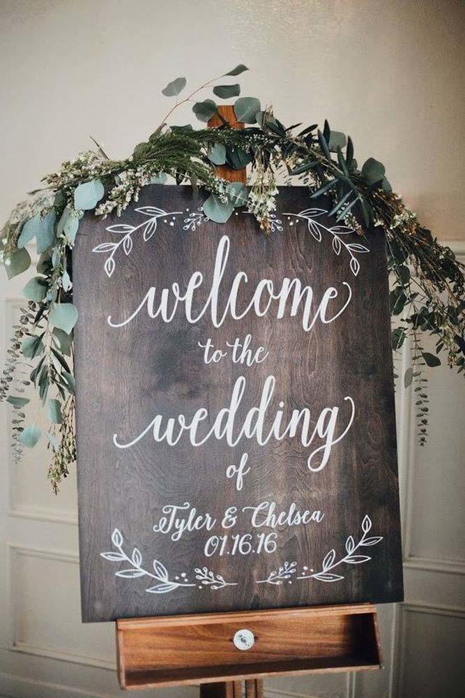 welcome rustic wood wedding signs with greenary