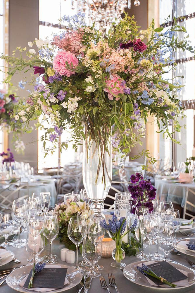 tall wedding centerpieces chic wild flowers pink peonies and greens in a transparent vase ira lippke studios