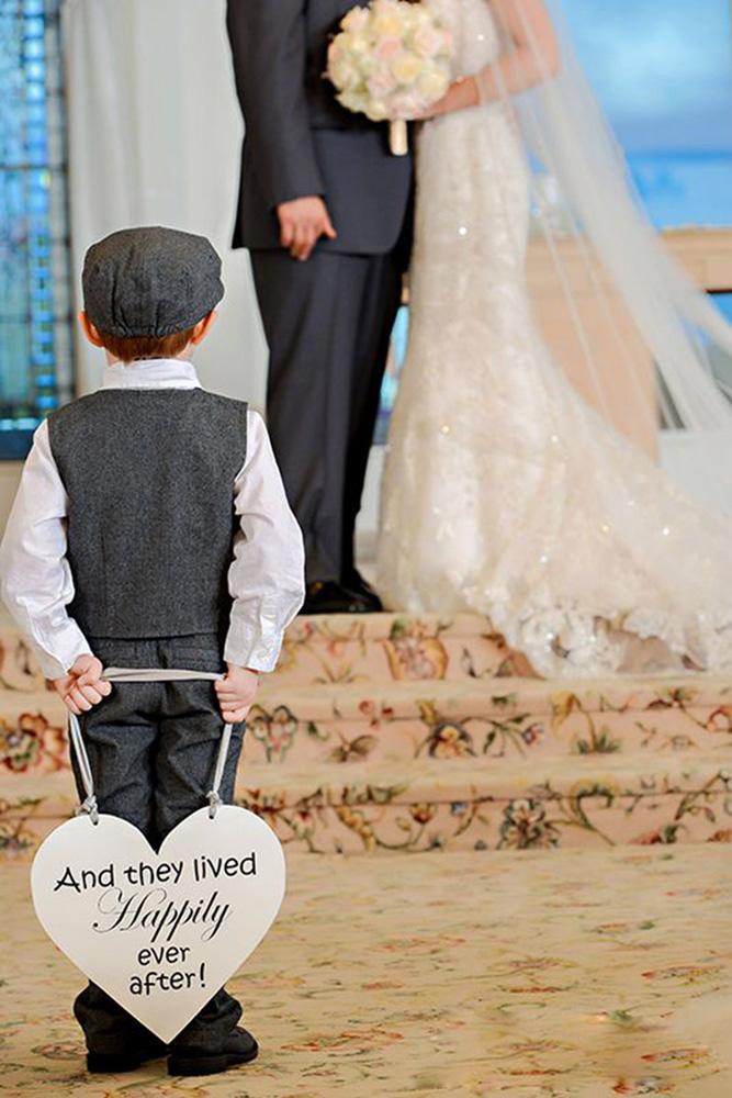ring bearer a boy with signs and couple fine art photography video