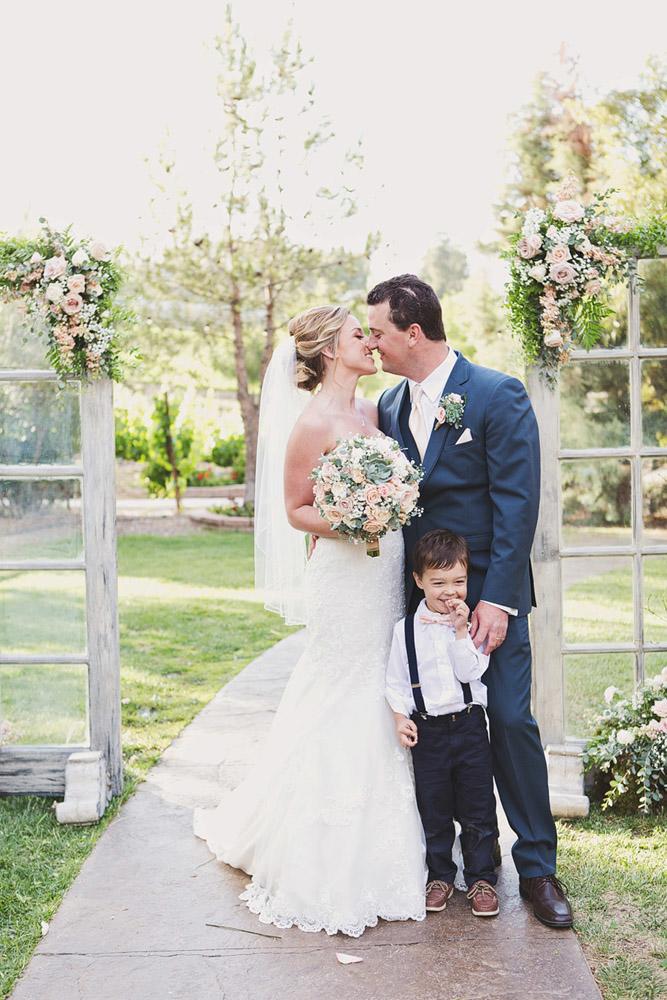 ring bearer happy couple with a boy april smith photography