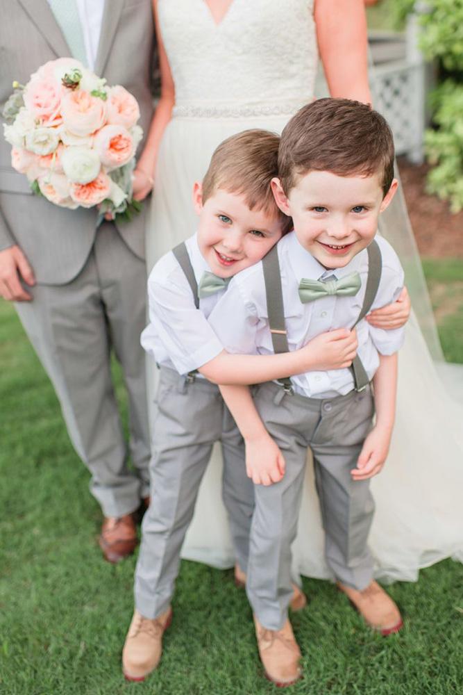 ring bearer two smiling boys in suits brita photography