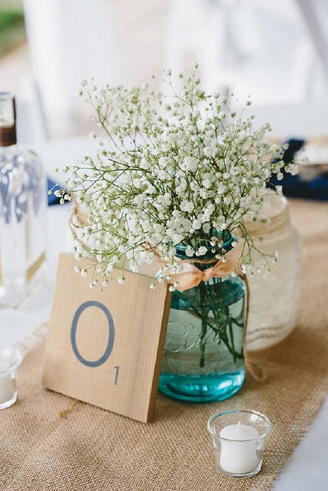 rustic wedding centerpieces flowers in blue mason jar with pink ribbon tablecloth braun photography