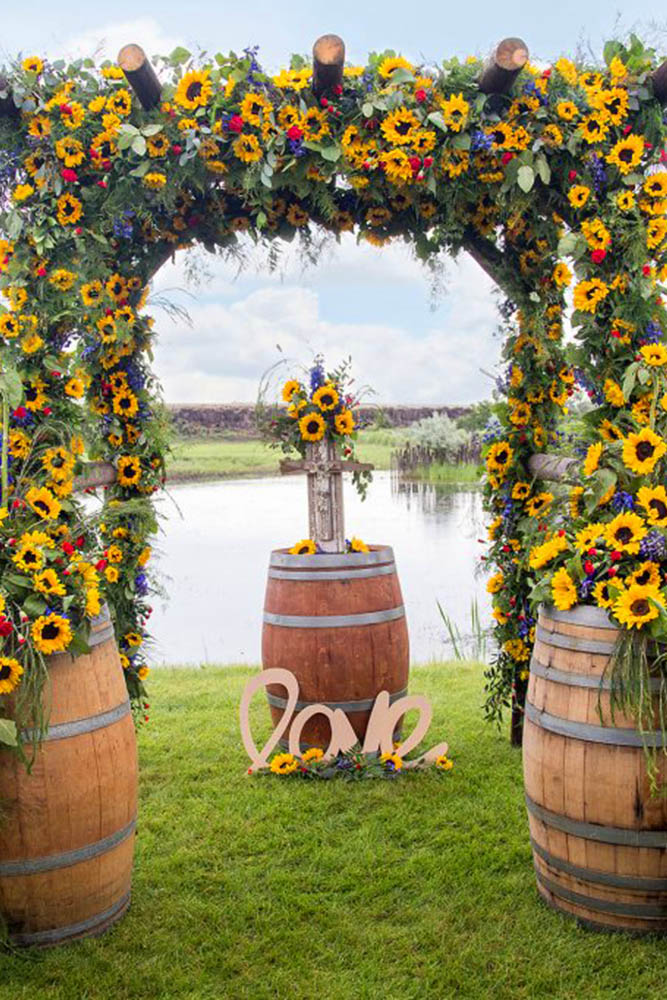 sunflower wedding decor ideas arch near water erica shurter