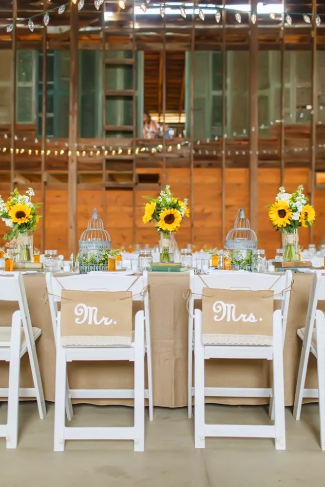 sunflower wedding decor ideas table and white chairs katienesbittphotography