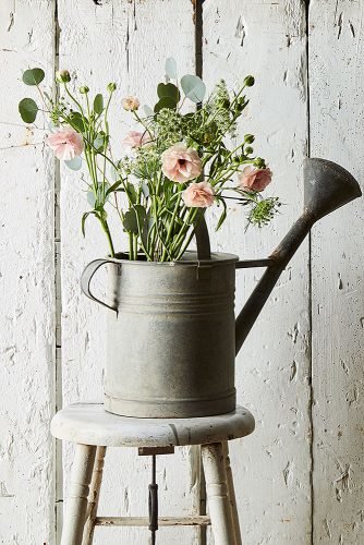 cute wedding ideas watering can filled with flowers