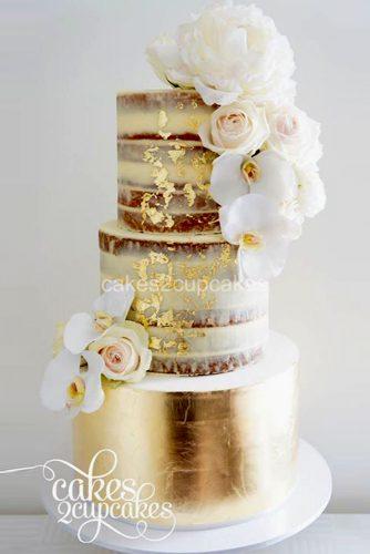 wedding cake designers gold cake with orhids and roses
