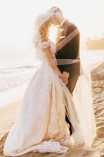 wedding photographers under veil on htebeach chardphoto