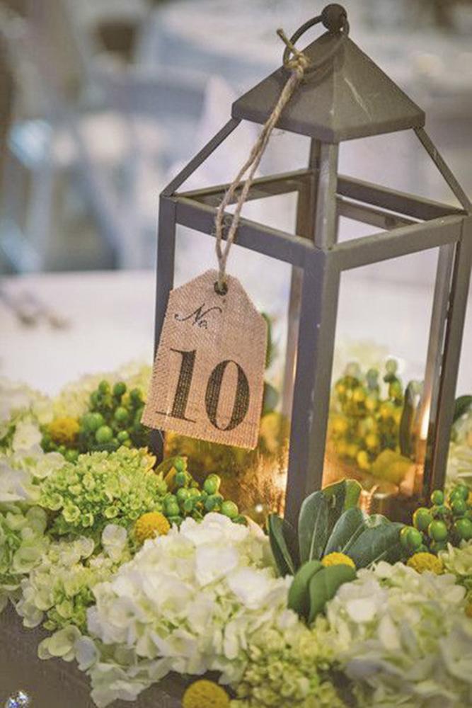 rustic wedding lanterns surrounded by flowers documentary associates