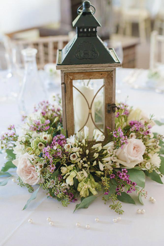 rustic wedding lanterns surrounded by flowers hannah mcclune photography