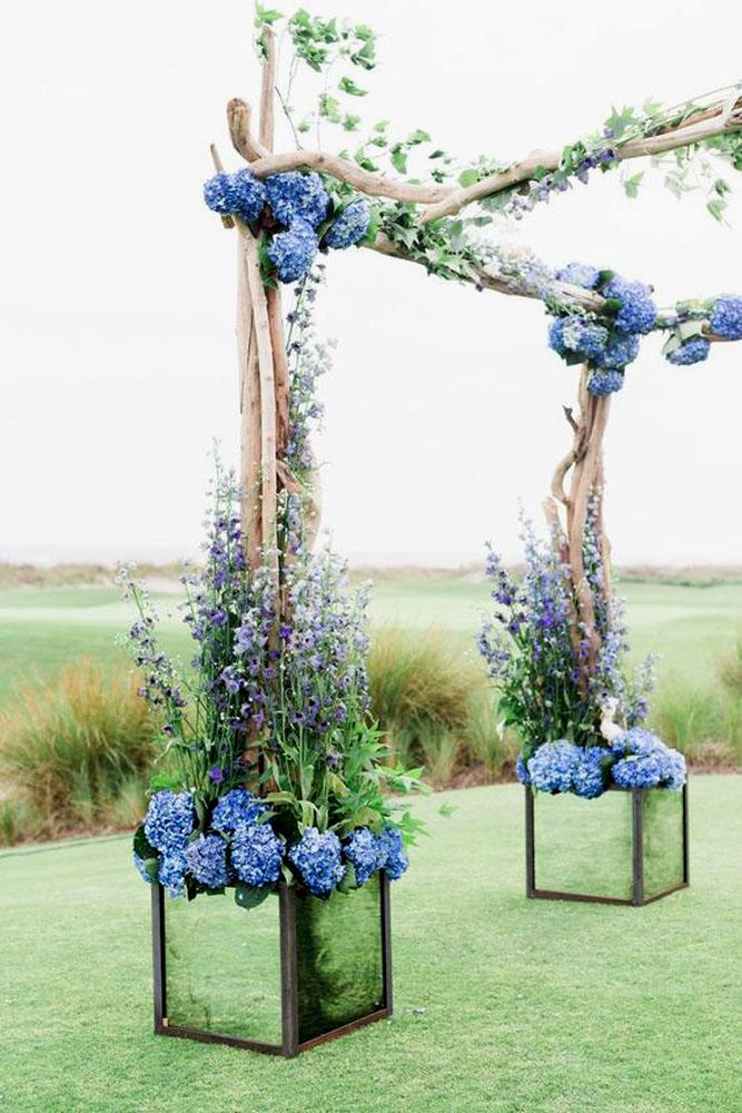 blue wedding theme arch with blue flowers