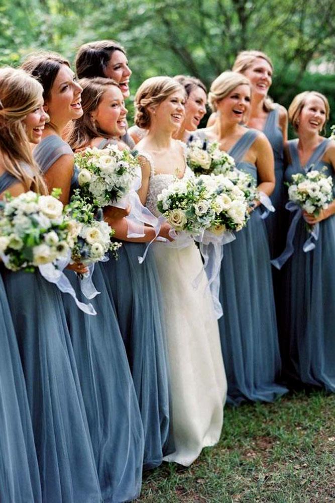 blue wedding theme bride with bridesmaids in blue dresses with bouquets