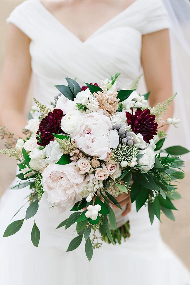 green wedding florals bouquet with roses of a peony burgundy dahlias and greens lidia codrean via instagram