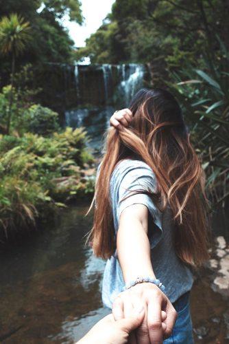 honeymoon destinations new zealand mokoroa falls waitakere and hand takes a girl
