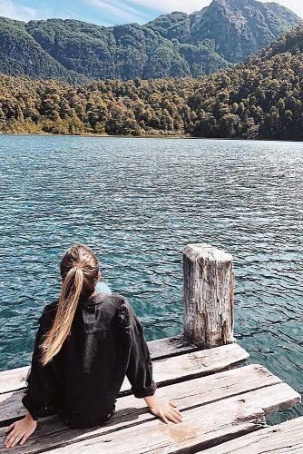 best honeymoon spots argentina girl sitting near water