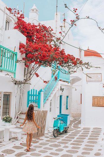 best honeymoon spots girl at the street mykonos greece