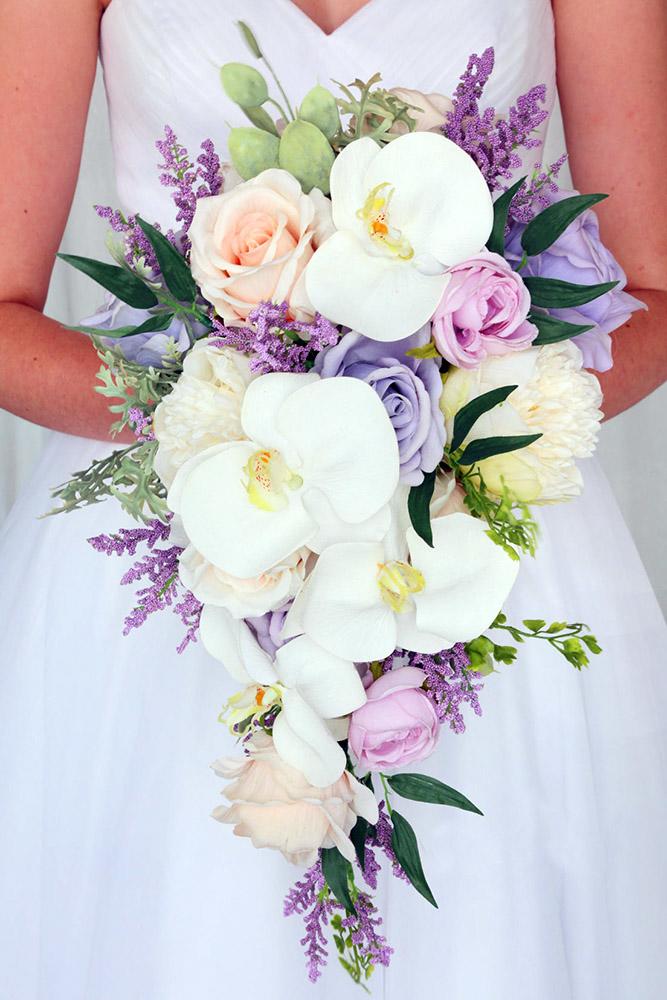 spring wedding bouquets cascading with orchids roses and lilac budgetbride