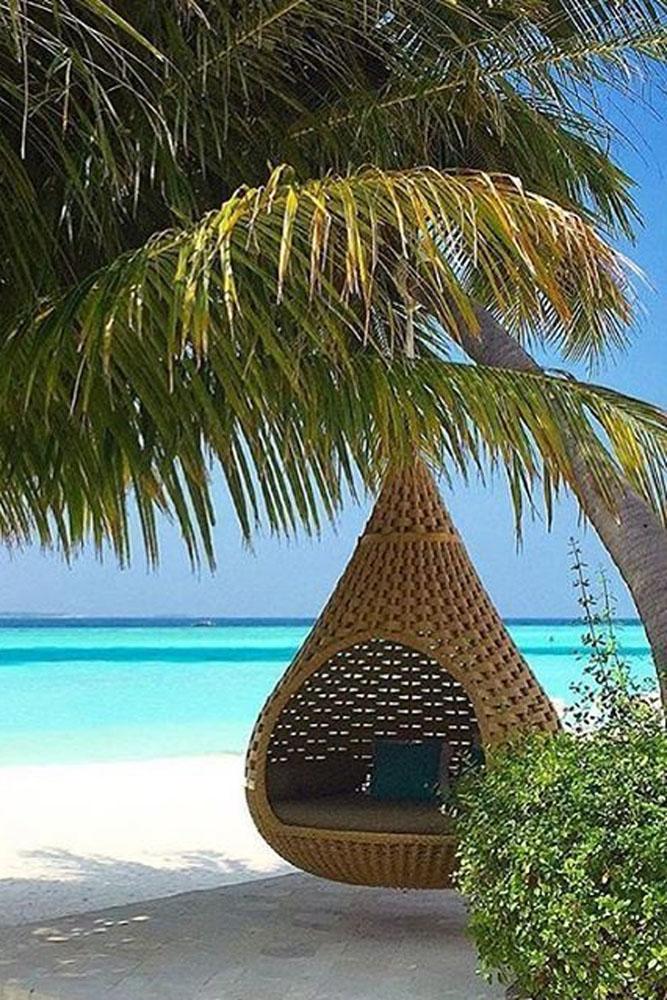 tropical honeymoon destinations maldives a comfort seat on the beach david moura do carmo via instagram