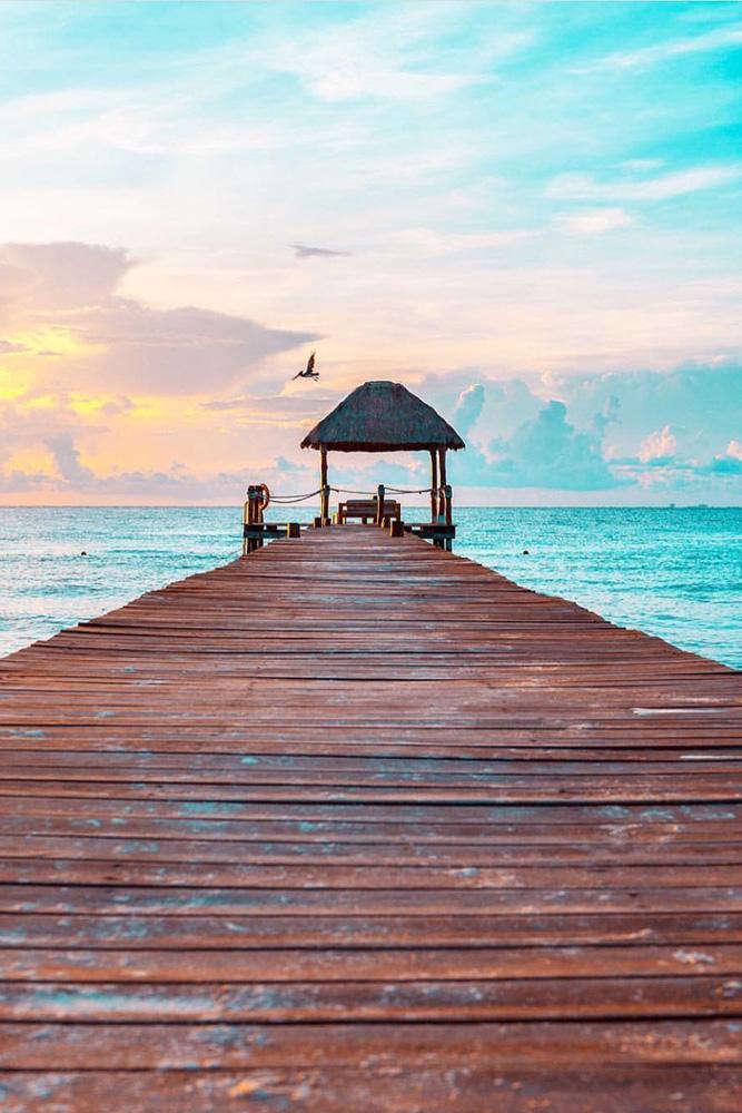 tropical honeymoon destinations mexico a wooden pier saaggo via instagram