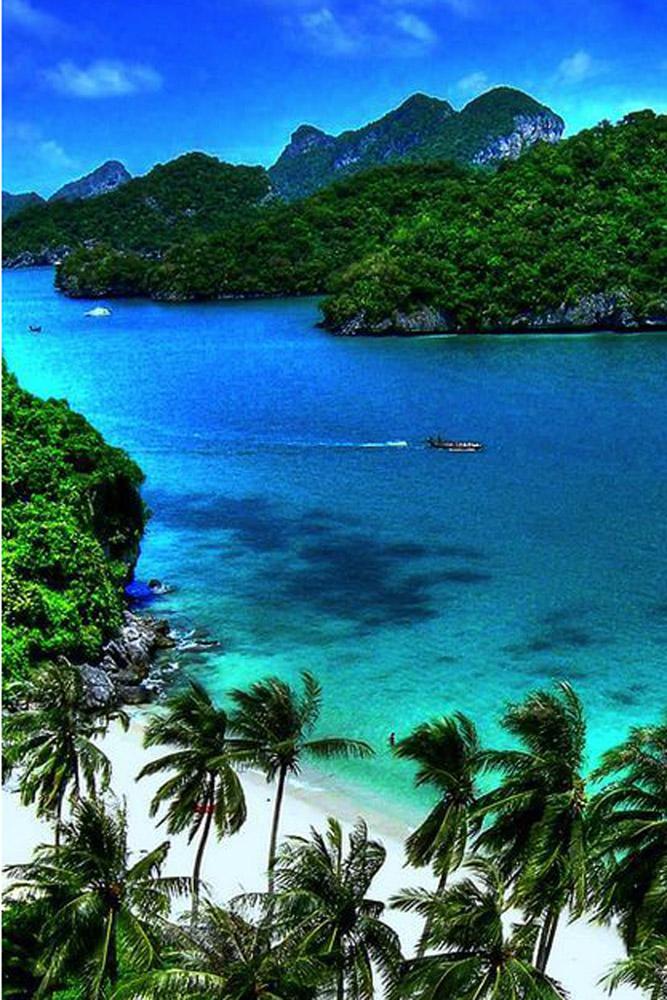 tropical honeymoon destinations thailand a beach and rocks chad galloway photo via flickr