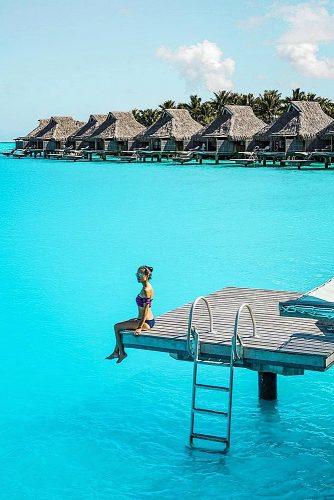 affordable honeymoon packages bora bora girl sitting near water