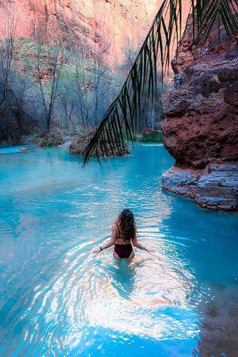 affordable honeymoon packages havasupai arizona girl relaxing in the lake