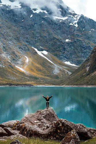 affordable honeymoon packages new zealand girl beautiful view mountains and lake