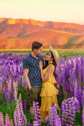 affordable honeymoon packages new zealand romantic couple in the blooming field