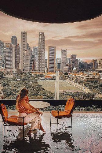 affordable honeymoon packages singapore girl in the cafe with city view