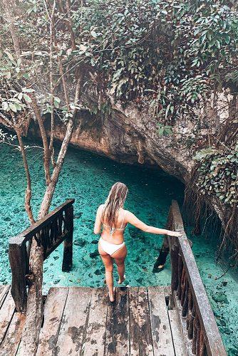 cheap honeymoon ideas tulum mexico girl in the water