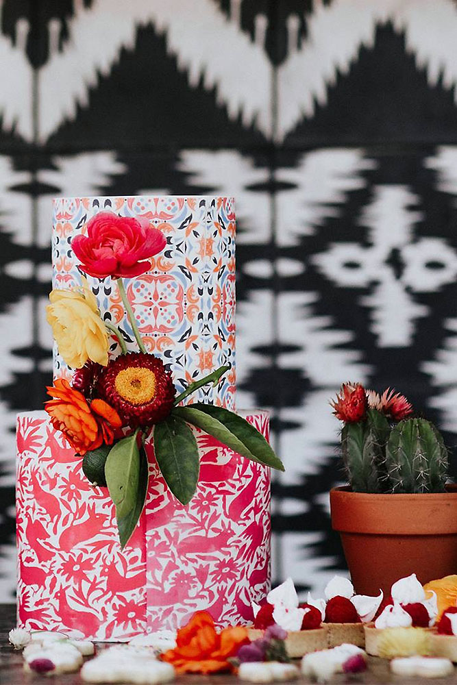 mexican wedding cake with bright patterns and fresh flowers by amy lynn photography via instagram