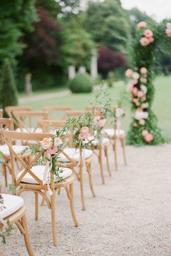 wedding ceremony decorations aisle decorated with blush peach flowers greg finck