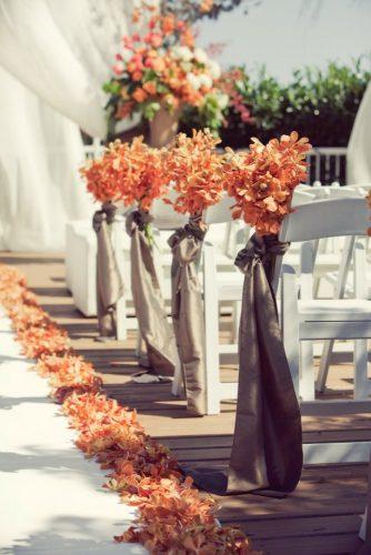 wedding ceremony decorations autumn aisle with gold leaves and ribbons leanne pedersen photographers