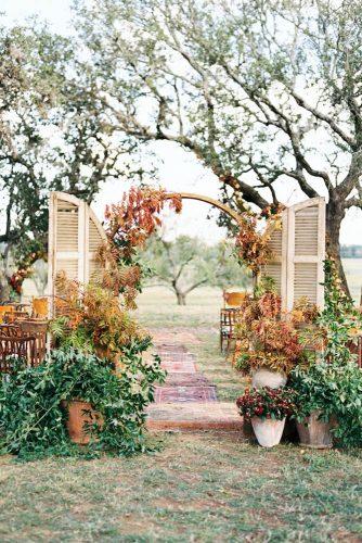 wedding ceremony decorations old door arch with green ang yellow leaves taylor lord