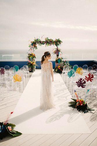 wedding ceremony decorations tropical with leaves and colorful flowers moana photography