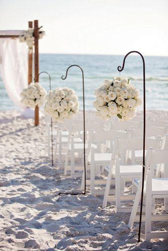 wedding ceremony decorations white flowers on the beach meg baisden photography