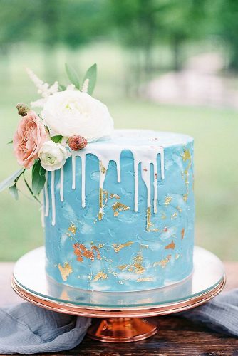 drip wedding cakes blue with golden details and white drops lauren brandon photo via instagram