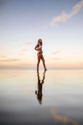 hawaii honeymoon girl against the sky near the water tentree