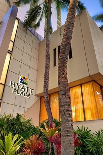 hawaii honeymoon view of the hotel building among the tropical greenery hyattplacewaikiki