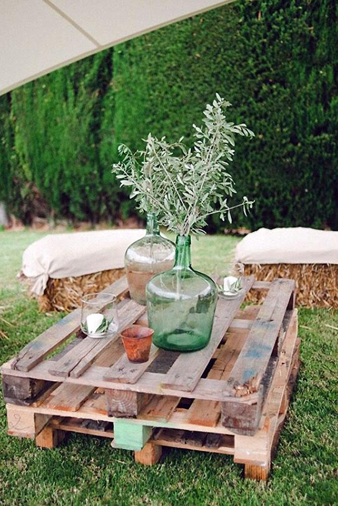 country wedding pallet with glass vases and greenery padilla & rigau photographers