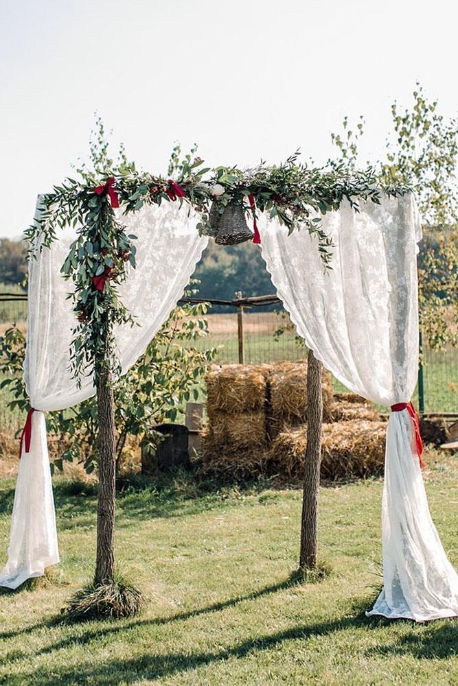 country wedding wooden arch decorated with lace and greenery deaalexandroni via instagram