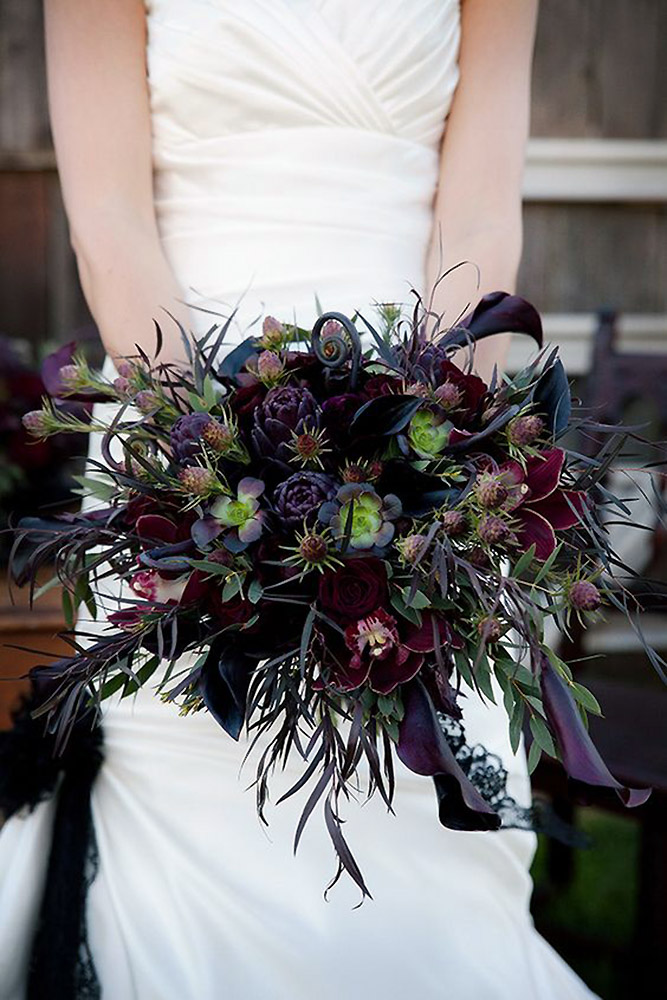 halloween wedding ideas a dark bouquet with orchids with a green and purple hue cameraartphoto