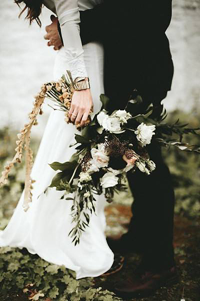 halloween wedding ideas contrast bouquet with dark and white flowers in the hands of the bride ash and james photography