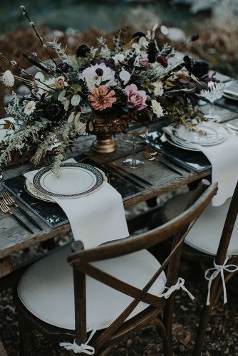 halloween wedding ideas wooden table decorated with a dark bouquet mysterious tyler branch