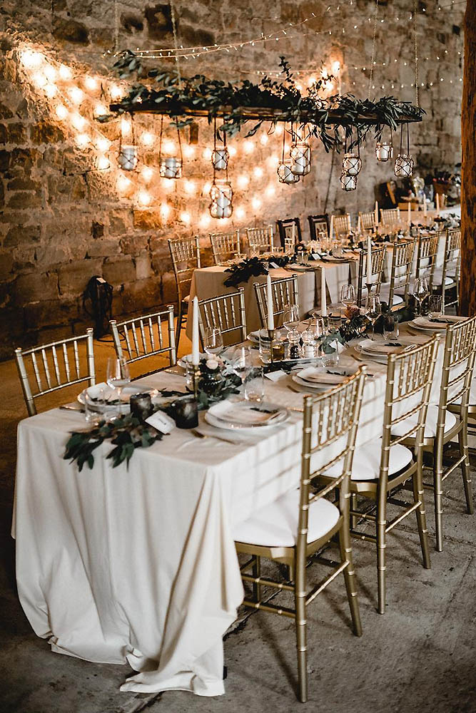 loft decorating ideas golden chairs white tablecloth decor greenery wall lights kathiundchris